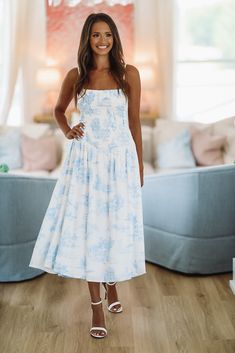 This stylish midi features adjustable straps and a smocked bodice. This is the perfect summertime dress! Fit: True to size, model is 5'6 wearing size small