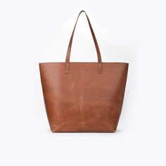 Product Overview: Upgrade your style with our handmade brown leather tote bag, crafted with care to meet your everyday needs. This stunning tote features luxurious lambskin leather, offering a combination of durability and sophistication. Perfect for daily commutes, shopping trips, or as a chic addition to your wardrobe, this tote is the definition of effortless style and function. Premium Quality Leather: Crafted from high-quality lambskin leather, this tote not only offers a sleek and polished Brown Bags With Leather Lining For Everyday Use, Brown Leather Lined Everyday Bag, Brown Leather Lining Bags For Everyday, Everyday Brown Bags With Leather Lining, Brown Bags With Leather Lining For Daily Use, Brown Leather Shoulder Bag With Waxed Finish, Handmade Leather Casual Bag, Casual Handmade Leather Bag, Light Brown Fall Bags For Everyday