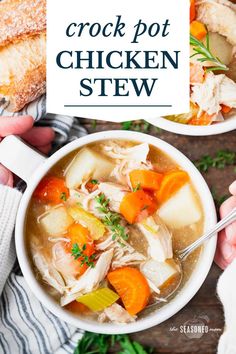 two bowls of crock pot chicken stew on a table with bread and carrots