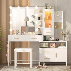 a white vanity with lights on it and a stool in front of the mirror that is open