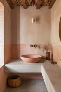 a bathroom with a large round bowl sink