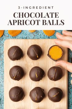 chocolate apricot balls on a wooden cutting board