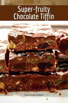 chocolate tiffins stacked on top of each other with the title super - fruity chocolate tiffin