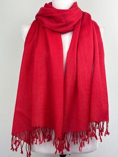 "This is a light weight all season wool shawl. This versatile shawl can be used to dress up an outfit for a special evening, as wedding favors, travel wrap or as a neck scarf in the winter. Easy to carry anywhere, perfect for when you need it at a restaurant or at the office in air conditioning or a cool summer evening. Effortlessly give a dress a new look by simply adding this shawl. A must have when you travel! Measures 26\"Wide x 74\"Long COLOR MATCHING/ACURACY The color is very close however is not exact, I tried to to capture the colour as acurately as possible but was not able to get the exact colour under any lighting.  In the pictures I have posted sometimes one picture looks like its a slighty different shade than others, please mention the specific color/picture you are intereste Red Silk Shawl For Winter, Classic Red Scarf Gift, Red Silk Shawl Scarf For Winter, Red Shawl Scarf For Winter, Red One-size Shawl As Gift, Solid Color Pashmina Shawl, Classic Solid Color Pashmina Scarves, Classic Solid Color Pashmina Scarf, Elegant Red Pashmina Scarf