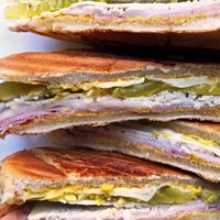 there are four sandwiches stacked on top of each other