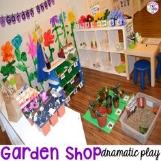 the children's garden shop has many plants and toys in pots on the floor