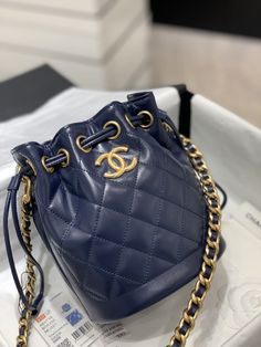 SHOP MORE LUXURY PRODUCTS HERE Description Chanel Small Drawstring Bucket Navy Blue Bag For Women 19cm/7.5in Size: 19 x 15 x 12.5 cm / 7.5 x 6 x 5 in Golden MetalCC logoNavy blue Includes dust bag.This product is of the premium quality. Designer Blue Bucket Bag, Designer Blue Bucket Bag With Dust Bag, Blue Luxury Pouch Bucket Bag, Luxury Blue Pouch Bucket Bag, Luxury Blue Bucket Bag For Shopping, Luxury Blue Bucket Bag With Gold-tone Hardware, Luxury Blue Bucket Bag For Travel, Elegant Blue Bucket Bag With Gold-tone Hardware, Navy Blue Bag