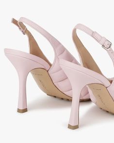 Indulge in refined elegance with the Bottega Veneta Padded Slingback Sandal in Pink. Crafted with a genuine leather upper, these sandals seamlessly combine luxury and comfort. The regular fit ensures an optimal and comfortable wearing experience for everyday wear. Elevating the design, the innovative bio-based rubber-injected and biodegradable leather outsole not only provides durability but also aligns with eco-conscious practices, making these sandals a chic and environmentally friendly choice. Step into a world where fashion meets sustainability with these meticulously crafted Bottega Veneta sandals. Bottega Veneta Sandals, Slingback Sandal, Bottega Veneta, Leather Upper, Everyday Wear, Genuine Leather, Sunglasses, Sandals, Leather