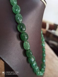 19'' AA Natural Green Strawberry Quartz 282 Carat Fine Quality Smooth Oval Beads Gemstone Necklace Stone :Natural Green Strawberry Quartz Shape :- Oval Size :- approx 6x8- 10x15 mm 1. Weight :- 282 carat - 21 inch Purity :- 100% Natural Gemstone Polish :- Handmade color - green makes a great gift for your loved ones. It is known as the 'love stone' as the message it emits is the strong vibration of unconditional love, joy, warmth and healing. As quartz crystals are profound amplifiers of energy, Oval Beaded Necklaces With Natural Stones For Gifts, Oval Single Strand Beaded Necklace As Gift, Oval Green Beaded Necklaces For Gifts, Oval Single Strand Beaded Necklace For Gift, Oval Natural Stone Beads For Gifts, Handmade Oval Green Beaded Necklace, Handmade Oval Emerald Necklace, Green Oval Gemstone Beaded Necklaces, Oval Green Gemstone Beaded Necklaces