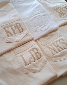 four white towels with kpb logos on them