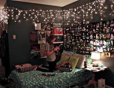 a woman sitting on top of a bed in a bedroom