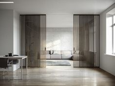 a living room with white walls and wooden slats on the wall, as well as an l shaped couch