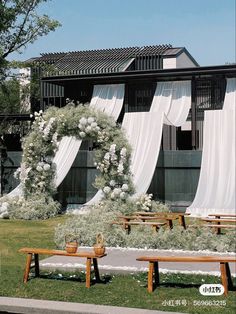 an outdoor wedding ceremony setup with flowers and greenery