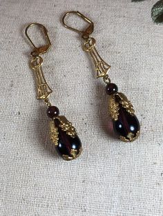 Antique Teardrop Earrings For Evening, Vintage Teardrop Jewelry With Lever Back Ear Wires, Vintage Teardrop Earrings For Pierced Ears, Vintage Purple Teardrop Earrings, Antique Formal Earrings With Ear Wire, Vintage Teardrop Pierced Plug Earrings, Vintage Bronze Teardrop Earrings, Vintage Teardrop Plug Earrings, Handmade Vintage Teardrop Plug Earrings