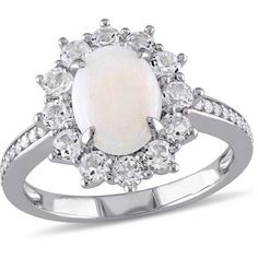 a white opal and diamond ring with an oval shaped stone surrounded by smaller round diamonds