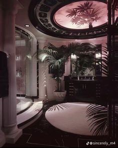 the bathroom is decorated in black and white with palm trees on the wall, round bathtub