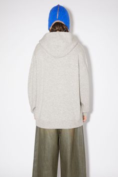 Acne Studios light grey melange hoodie is crafted from a wool and cashmere blend, cut to a relaxed fit. FN-MN-KNIT000339 Winter Cashmere Hoodie For Loungewear, Cozy Wool Hooded Hoodie, Wool Hoodie With Ribbed Cuffs, Acne Studios Blanket, Acne Knitwear, Acne Sweater, Acne Studios Hoodie, Acne Studio Jackets, Cashmere Hoodie