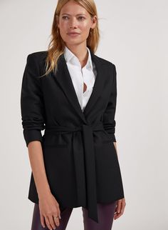 Description Fits true to size, we suggest ordering your normal size. Meet a classic black jacket with an elegant twist. The Amal is tailored with strong shoulders and a neat waist, which you can draw in with the co-ordinating belt. A smart foundation piece for any wardrobe, this is your secret weapon for work days and evenings out with a pencil skirt or dark denim. After a head-to-toe look? Try Amal with the Shapira tailored pant for a chic slant on power dressing. Crafted in Newlife recycled po Strong Shoulders, Power Dressing, Fabric Belt, Tailored Pants, Women's Coats & Jackets, Dark Denim, Black Jacket, Fashion Collection, Classic Black