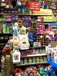 a store filled with lots of different types of candy and candies on display for sale