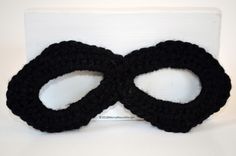 Baby superhero mask for Halloween or photo shoots. Perfect for the super heroes (or villains!) in your life. Makes a great gift. Due to the nature of handmade items, each mask is distinctly unique! Crochet masks may be machine washed in cold water, and tumble dried on low heat. Due to the properties of the yarn, mask will become softer to the touch with each wash. These baby crochet masks measure ~6.5" across and have the option of either tie backs or elastic strap. Please state strap choice whe Handmade Black Masks And Prosthetics For Costume, Black Superhero Mask For Masquerade, Black Superhero Masquerade Mask, Black Superhero Cosplay Masks, Handmade Halloween Masks As Gifts, Fun Black Masks For Masquerade, Handmade Black Masks For Costume Party, Fun Black Mask For Masquerade, Black Masks For Halloween Gift