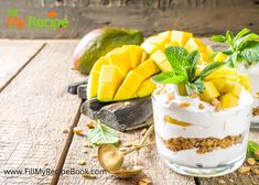 two desserts are sitting on a table with fruit and other items around the bowl