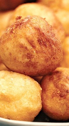 some fried food in a white bowl on a table