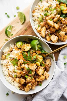 two bowls filled with chicken and vegetables on top of rice