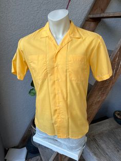 "This superb, genuine 1980s collared shirt is in excellent vintage condition! It' is roughly the color of Florida gulf coast summer twilight. I'd say the picture on the mannequin shows the truest color. Made by Islander. Check the measurements: SIZE: Pit to pit: 21\" Collar to hem: 28\" Sleeves: 8\" The tag says medium. Check the measurements. The male mannequin would be about 5'10\", 175 lbs. ITEM 622" Retro Summer Shirt With Collared Neckline, Retro Collared Shirt For Summer, Retro Collared Hawaiian Shirt With Relaxed Fit, Retro Relaxed Fit Collared Hawaiian Shirt, Vintage Button-up Hawaiian Shirt For Summer, Retro Collared Summer Shirt, Orange Cotton Camp Shirt For Summer, Orange Collared Camp Shirt For Summer, Summer Orange Cotton Camp Shirt