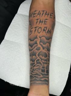 a man's arm with the words weather and storm on it