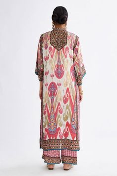 Primrose silk tunic featuring paisley and geometric prints with guzette sleeves, Fit: Relaxed Silk Ikat Print Kaftan For Festive Occasions, Silk Kaftan With Ikat Print For Festive Occasions, Silk Kaftan With Dupatta For Festival, Silk Bohemian Tunic With Floral Print, Bohemian Silk Tunic With Floral Print, Bohemian Silk Tunic With Kimono Sleeves, Bohemian Ikat Print Patterned Kurta, Bohemian Patterned Kurta With Printed Motifs, Eid Kaftan With Digital Print In Straight Kurta Style