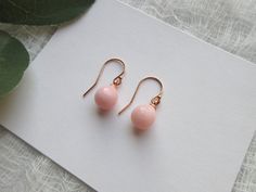 Pretty and Dainty Pink Peruvian Opal Teardrop Pearl Earrings. These are natural pink Opal, October birthstone, gorgeous lovely soft pink with some darker pink shaded. ITEM SPECIFICATIONS : * Length of earring: approx. 20mm * Material: 925 Sterling Silver * Finish: 14K Gold Filled, 18k Rose Gold Filled or 925 Sterling Silver * Size of Pink Opal: 8x9mm How to order: 1. Select the material finish you like. 2. Select the style of earrings you like. If you like a pendant to match, we can craft them as well, please contact us. Earrings are considered as Intimate items and can not be returned due to health/hygiene reasons. A ribbon jewelry box is provide for free ready for gifting, if you like us to hand write a hearty note, a heart shape card will be provided too, just drop the note in message b Elegant Pink Gold Hypoallergenic Jewelry, Elegant Hypoallergenic Pink Gold Jewelry, Elegant Hypoallergenic Pink Gold Earrings, Elegant Pink Gold Jewelry With Ear Wire, Delicate Rose Gold Drop Earrings, Teardrop Pearl Earrings, Pink Opal Earrings, Ribbon Jewelry, Earrings Teardrop