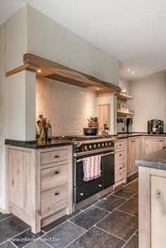 a kitchen with an oven, stove and counter tops in it's center island