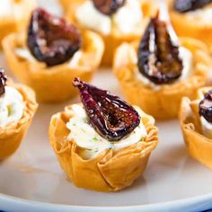 small appetizers with figs and cream cheese on a plate