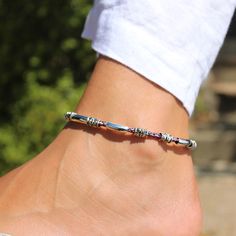 Introducing the Rayette Braided Leather & Silver Anklet - a summer essential that will add a bit of colorful flair to your look! With a single braided leather strand adorned with shiny silver-plated beads and crescents. The stainless steel clasp ensures a secure fit all day long - so now you can look fabulous and forget about it! This unique design is a beauty that looks fantastic with any shade of denim. Try this bracelet with the Austin earrings. single round braided leather strand silver plat Single Braid, Silver Anklet, Summer Essential, Silver Anklets, Purple Leather, Leather Silver, Braided Leather, Shiny Silver, Summer Essentials