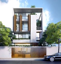 a car parked in front of a tall white building with wooden shutters and balconies