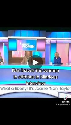 two women are sitting down on the set of an interview, one is talking to another woman