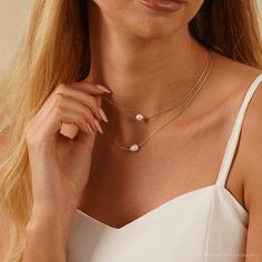 This exquisite jewelry made from genuine freshwater pearls is perfect for weddings. Its timeless elegance suits brides, bridesmaids, and the mother of the bride. Ideal for any special occasion, it adds a touch of sophistication and makes a cherished gift. F E A T U R E S * 100% Natural Freshwater Pearls * Material: High Quality Solid Copper * Finish: 925 Silver, 18K Gold A T T E N T I O N ♥ Please keep in mind that these are natural pearls. While I do my best to closely match each pair, they may Gold Pearl Drop Necklace For Bridesmaids, Gold Pearl Drop Bridal Necklace For Bridesmaid Gift, 14k Gold-filled Pearl Drop Necklace For Wedding, Multi-strand Pearl Drop Wedding Necklace, 14k Gold-filled Pearl Pendant Necklace For Weddings, Double Layer Necklace, Freshwater Pearl Necklaces, Bridal Necklace, Exquisite Jewelry