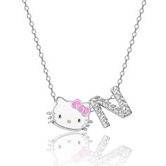 a hello kitty necklace on a chain with a letter j in the middle and a pink bow at the bottom