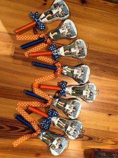 several pairs of shoes with polka dots on them are lined up in the shape of people's feet