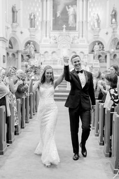 a newly married couple walking down the aisle