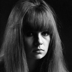 a black and white photo of a woman with long hair