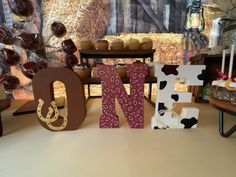 the letters are made out of wood and decorated with chocolates