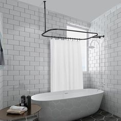 a white bath tub sitting next to a window