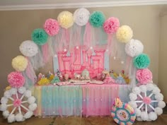 a table with balloons and decorations for a princess themed birthday party or baby's first birthday