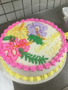 a decorated cake sitting on top of a counter