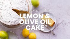 a lemon and olive oil cake on a plate next to two plates with lemons