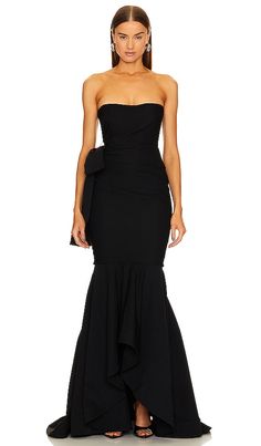 Find MICHAEL COSTELLO X Anyssa Gown on Editorialist. Michael Costello x REVOLVE Anyssa Gown in Black. - size M (also in S, XS, XXS) Michael Costello x REVOLVE Anyssa Gown in Black. - size M (also in S, XS, XXS) Make a statement with the Anyssa Gown. Its boned bodice ensures a flattering fit, while the bengaline fabric drapes elegantly. The back features a detachable bow detail, adding a touch of drama. This gown is the ultimate formal attire, your not-so-little black dress that's bound to turn h Fishtail Gown, Black Tie Attire, Michael Costello, Mob Dresses, Black Gown, Norma Kamali, Formal Attire, Draped Fabric, Revolve Clothing