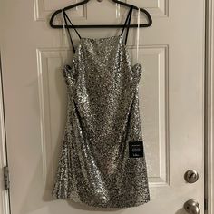 Lulu’s Sequin Mini Dress. Size L. New With Tags, Never Worn. Silver Sequin Dress With Glitter For Holiday, Silver Glitter Mini Dress For Evening, Silver Mini Dress For Prom And Holiday, Silver Glitter Dresses For Night Out, Silver Sequin Dress For Date Night Holiday, Silver Glitter Mini Dress For Cocktail Occasions, Silver Glitter Mini Dress For Cocktail, Silver Sleeveless Glitter Dress, Silver Holiday Dress For Date Night