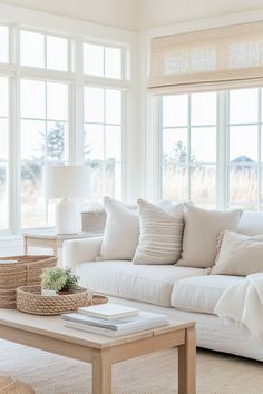 a living room filled with furniture and large windows