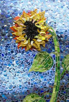 a sunflower is depicted on a mosaic background